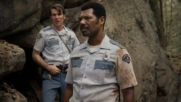 Cameron Scoggins and William Catlett as the local police officers