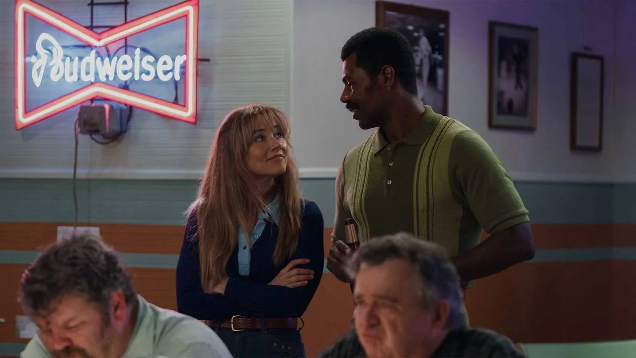 Pam and Levon talk at the bowling alley